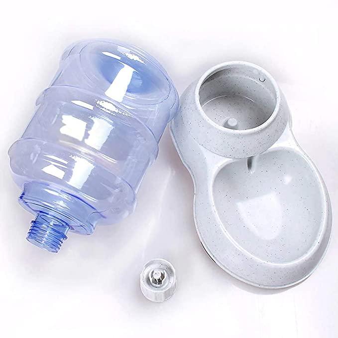 Clear blue bottle cap and white pet water bowl on a white background